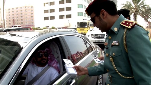 Ajman police distributes headsets marking GCC Traffic Week and Year of Giving 